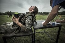 A female subject is assessed by Lt. Col. Ryan W. Logan, Air Force Fitness Testing and Standards Unit, June 19, 2015, in support of the Physical Fitness Tests and Standards study at Joint Base San Antonio-Lackland, Texas. The Airman is a volunteer in the fitness study, which supports the Air Force’s Women in Service Review. The study aims to establish occupationally-specific, operationally-relevant physical fitness standards for Battlefield Airmen. All male and female subjects undergo 39 fitness tests and 15 physical task simulations to link fitness tests and standards to operational tasks and requirements. (U.S. Air Force Photo by 1st Lt. Jose R. Davis)
