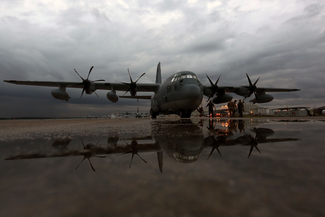 Marines conduct a pre-flight inspection of a KC-130J Super Hercules at Marine Corps Air Station Cherry Point, North Carolina, Aug. 11, 2015. Marine Aerial Refueler Transport Squadron 252's mission is to support the Marine Air-Ground Task Force commander by providing air-to-air refueling, assault support, and offensive air support, day or night under all weather conditions during expeditionary, joint, or combined operations. (U.S. Marine Corps photo by Cpl. N.W. Huertas/Released)