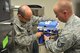 U.S. Air Force Tech. Sgts. Christian Bond and Zach Brown, 97th Medical Group bioenvironmental medical equipment technicians, change a filter on a reverse-osmosis water treatment setup inside the dental clinic at Altus Air Force Base, Oklahoma, Aug. 13, 2015. Bond and Brown change the filters monthly to ensure the dental clinic has clean water for cleaning and sanitizing dental equipment. (U.S. Air Force photo by Senior Airman Dillon Davis)