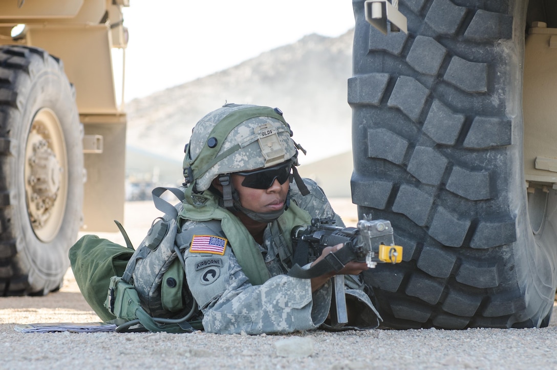 U.S. Army Reserve warrant officer candidate Sofia Olds, an automated logistical specialist with the 787th Combat Sustainment Support Battalion in Dothan, Ala., reacts to simulated mortars in a vehicle staging area at Forward Operating Base Santé Fe at the National Training Center, Fort Irwin, Calif., Aug. 15, 2015. U.S. Army photo by Army Spc. Michael Germundson