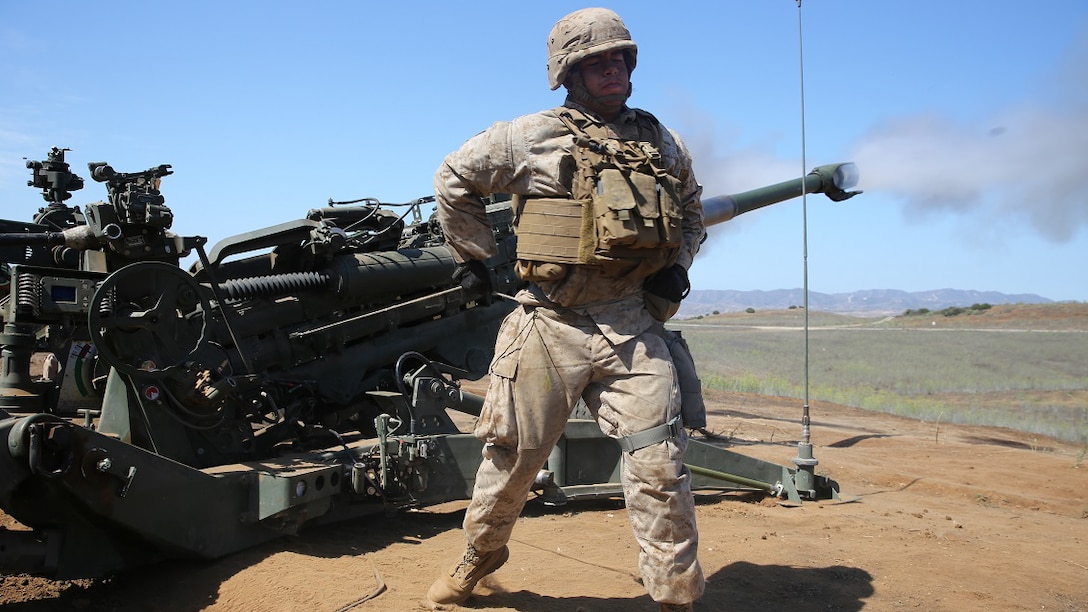 Corporal Alredo Mireles, a field artillery cannoneer with Battery B, 2nd Battalion, 11th Marine Regiment, 1st Marine Division, fires an M777 Howitzer during Summer Fire Exercise 15, at Marine Corps Base Camp Pendleton, Calif., Aug. 13, 2015. The exercise, which spans Aug. 6-17, provides an opportunity for Marines to practice standing operating procedures for coordinating and executing fire missions in preparation for future operations.