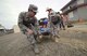 Capt. Jonathon Miller, with the 124th Fighter Wing Medical Group, Idaho Air National Guard, and Oregon Army National Guard Capt. Amy Kerfoot, right, lift a simulated casualty during Pathfinder-Minutemen Exercise Aug. 5, 2015 at Camp Rilea in Warrenton, Oregon. The event is a joint multi-agency, multi-state disaster preparedness exercise based on response to a possible Cascadia Subduction Zone event. Officials believe the Northwest is overdue for a magnitude 7.0 or greater earthquake. (U.S. Air National Guard photo by Tech. Sgt. John Hughel, 142nd Fighter Wing Public Affairs/Released)