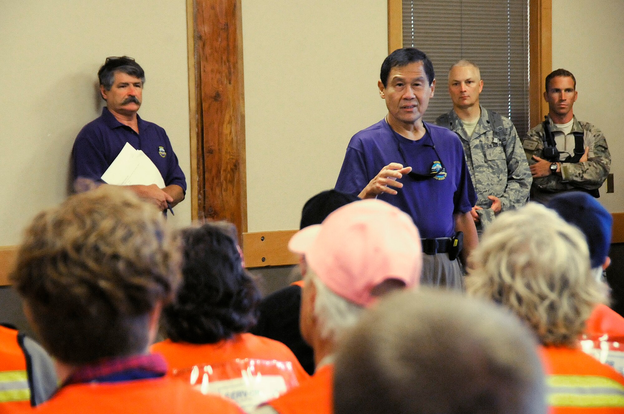 Dr. Jon Jui, Oregon Disaster Medical team lead, delivers a morning brief to the participants taking part in the Pathfinder-Minutemen Exercise, Aug. 5, 2015 at Camp Rilea in Warrenton, Oregon. The event is a joint multi-agency, multi-state disaster preparedness exercise based on response to a possible Cascadia Subduction Zone event. Officials believe the Northwest is overdue for a magnitude 7.0 or greater earthquake. (U.S. Air National Guard photo by Tech. Sgt. John Hughel, 142nd Fighter Wing Public Affairs/Released)