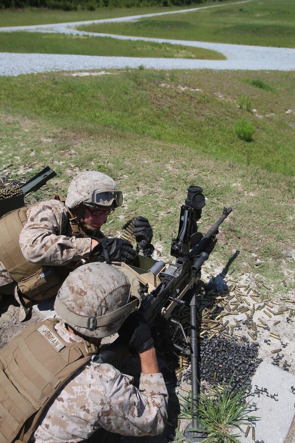Marines with Truck Company, Headquarters Battalion, 2nd Marine Division fire the M240B Machine Gun aboard Camp Lejeune, N.C. Aug. 13, 2015. The three weapons Truck Co. shot are crew- served weapons systems and require communication to operate properly. (U.S. Marine Corps photo by Pfc. Miranda Faughn/Released)