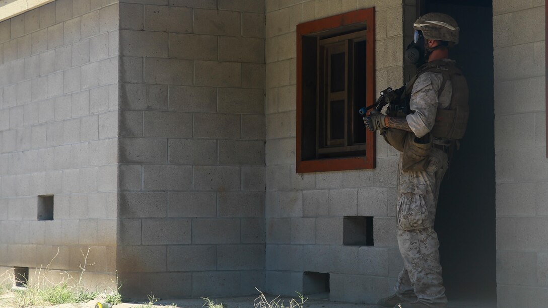 A Marine with 2nd Battalion, 7th Marine Regiment, provides security during the culminating event of 1st Marine Division Schools’ Urban Leaders Course at Marine Corps Base Camp Pendleton, Calif., Aug. 12, 2015. The course is a 15-day period of instruction that includes classwork, combat marksmanship and physical training executed in a simulated urban combat environment. 