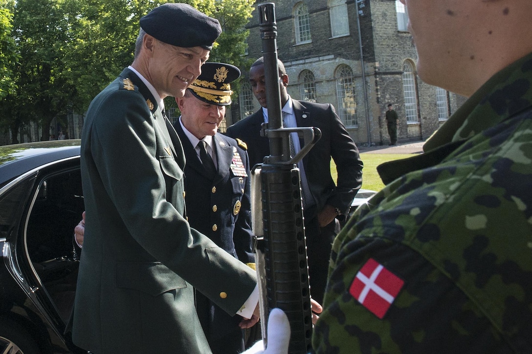 Danish Chief of Defense Army Gen. Peter Bartram greets U.S. Army Gen. Martin E. Dempsey, second from left, chairman of the Joint Chiefs of Staff, at the Defense command headquarters in Copenhagen, Denmark, Aug. 17, 2015. DoD photo by D. Myles Cullen 
