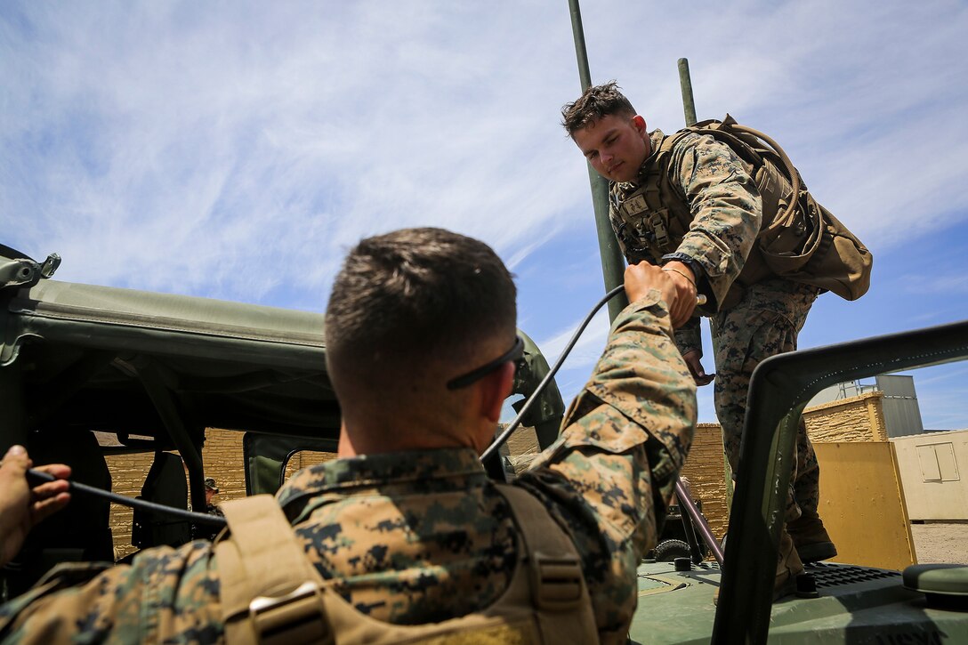 Marines with Company B, 1st Battalion, 1st Marine Regiment set up communication assets after conducting Military Operations in Urban Terrain in a simulated combat town by using M1161 Internally Transportable Vehicles during the first phase of a Limited Objective Experiment aboard Marine Corps Base Camp Pendleton, Calif., Aug. 13, 2015. The experiment is comprised of  the integration of ITVs with infantry units to provide the Marine Corps Warfighting Laboratory with an understanding of how the vehicles will be added to the battalions. The second part of the experiment will take place at Fort Hunter Liggett, Calif., which will provide the Marines with extensive amounts of terrain to test the vehicles’ capabilities over a 3-week training period. (U.S. Marine Corps Photo by Sgt. Rick Hurtado / Released)