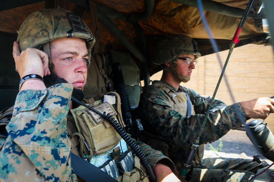 Corporal Richard Bork, left, an assaultman from Midland, Mich., and Pfc. Maverick Peterson, a basic rifleman from New London, Wis., both with Company B, 1st Battalion, 1st Marine Regiment, drive an M1161 Internally Transportable Vehicle through a simulated combat town during the first phase of a Limited Objective Experiment aboard Marine Corps Base Camp Pendleton, Calif., Aug. 13, 2015. The experiment is comprised of the integration of ITVs with infantry units to provide the Marine Corps Warfighting Laboratory with an understanding of how the vehicles will be added to the battalions. The second part of the experiment will take place at Fort Hunter Liggett, Calif., which will provide the Marines with extensive amounts of terrain to test the vehicles’ capabilities over a 3-week training period. (U.S. Marine Corps Photo by Sgt. Rick Hurtado / Released)