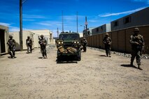 Marines with Company B, 1st Battalion, 1st Marine Regiment, escort an M1161 Internally Transportable Vehicle through a simulated combat town during the first phase of a Limited Objective Experiment aboard Marine Corps Base Camp Pendleton, Calif., Aug. 13, 2015. The experiment is comprised of the integration of ITVs with infantry units to provide the Marine Corps Warfighting Laboratory with an understanding of how the vehicles will be added to the battalions. The second part of the experiment will take place at Fort Hunter Liggett, Calif., which will provide the Marines with extensive amounts of terrain to test the vehicles’ capabilities over a 3-week training period. (U.S. Marine Corps Photo by Sgt. Rick Hurtado / Released)