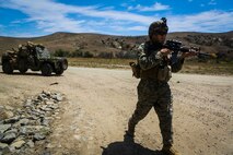 Sergeant Edwin Orozco, a native of San Bernardino, Calif., and a platoon sergeant with Company B, 1st Battalion, 1st Marine Regiment, escorts an M1161 Internally Transportable Vehicle during the first phase of a Limited Objective Experiment aboard Marine Corps Base Camp Pendleton, Calif., Aug. 13, 2015. The experiment is comprised of the integration of ITVs with infantry units to provide the Marine Corps Warfighting Laboratory with an understanding of how the vehicles will be added to the battalions. The second part of the experiment will take place at Fort Hunter Liggett, Calif., which will provide the Marines with extensive amounts of terrain to test the vehicles’ capabilities over a 3-week training period. (U.S. Marine Corps Photo by Sgt. Rick Hurtado / Released)