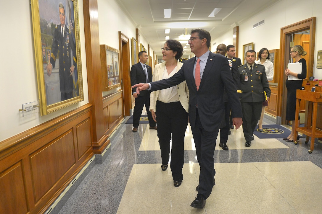 U.S. Defense Secretary Ash Carter welcomes Georgian Defense Minister Tinatin Khidasheli to the Pentagon, Aug. 18, 2015, while showing her the portrait of U.S. Army Gen. John M. Shalikashvili, former chairman of the Joint Chiefs of Staff. Born in Warsaw, Poland, to Georgian parents, Shalikashvili served as the chairman from 1993 to 1997. The two defense leaders met to discuss matters of mutual importance. DoD photo by Glenn Fawcett
