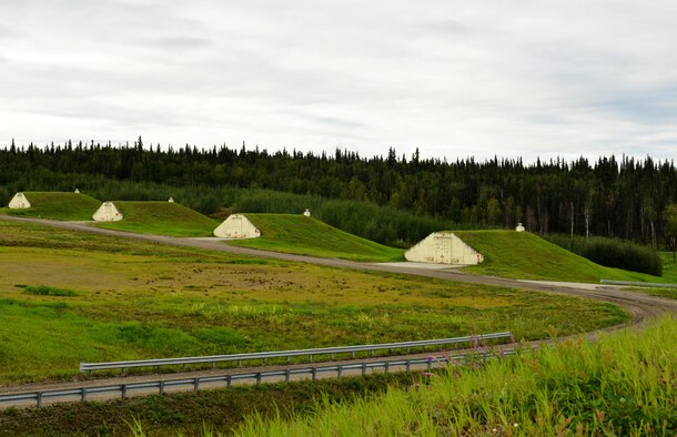 Earth-covered igloos are designed to protect munitions while they are stored and keep people safe at Eielson Air Force Base, Alaska. U.S. Air Force Airmen from the 354th Maintenance Squadron munitions flight are responsible for maintaining security and operability over these bunkers and escort contractors and other Airmen out to the bunkers as the need arises. (U.S. Air Force photo by Airman 1st Class Kyle Johnson/Released)