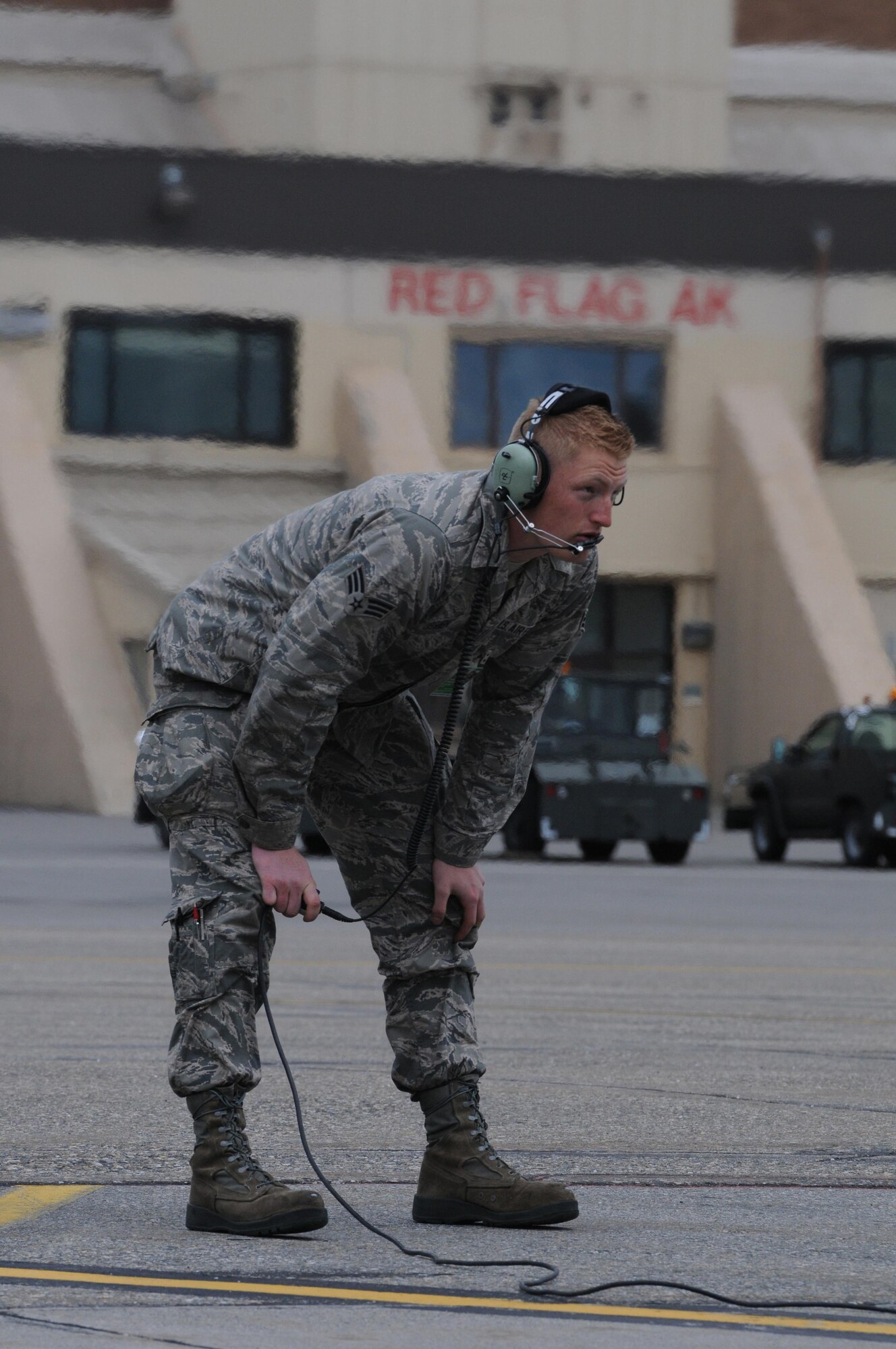 U.S. Air Force Senior Airman Jacob O'Brien, a 148th Fighter Wing crew chief, Duluth, Minnesota, goes through pre-flight checks with an F-16 pilot, Aug. 10, 2015, while participating in RED FLAG-Alaska 15-3 at Eielson Air Force Base, Alaska.  RF-A is a Pacific Air Forces commander-directed field training exercise for U.S. and partner nation forces, providing combined offensive counter-air, interdiction, close air support and large force employment training in a simulated combat environment.  (U.S. Air Force photo by Master Sgt. Ralph Kapustka/Released)