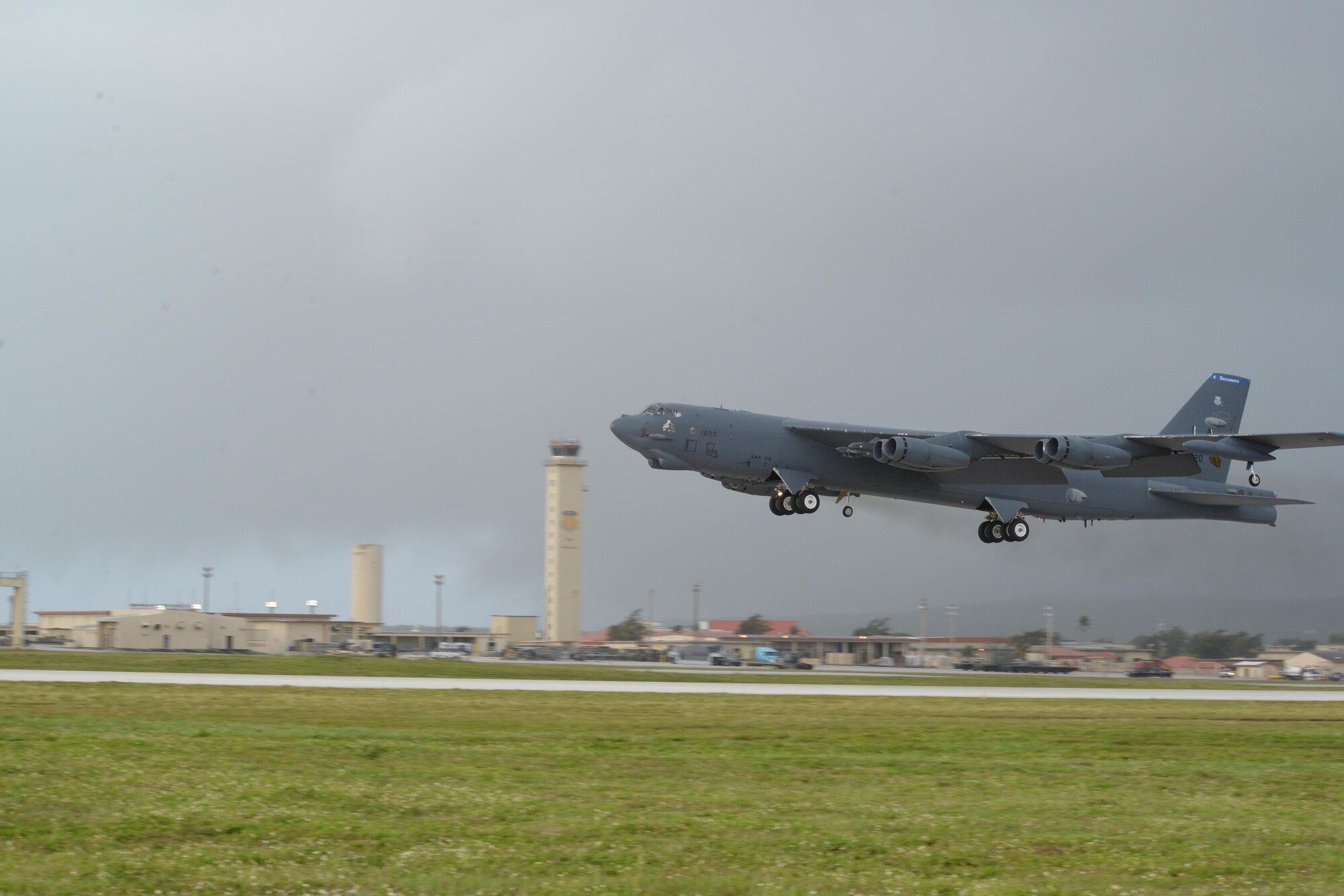 A U.S. Air Force B-52 Stratofortress and accompanying aircrew take off April 23, 2015, at Andersen Air Force Base, Guam. Airmen and Sailors came together Aug. 12, 2015, for a day-long test called “Clutch Shot” with the objective of shooting a missile from two different points and hitting a target simultaneously. A B-52 was used to record data from the test. (U.S. Air Force photo by Senior Airman Amanda Morris/Released)