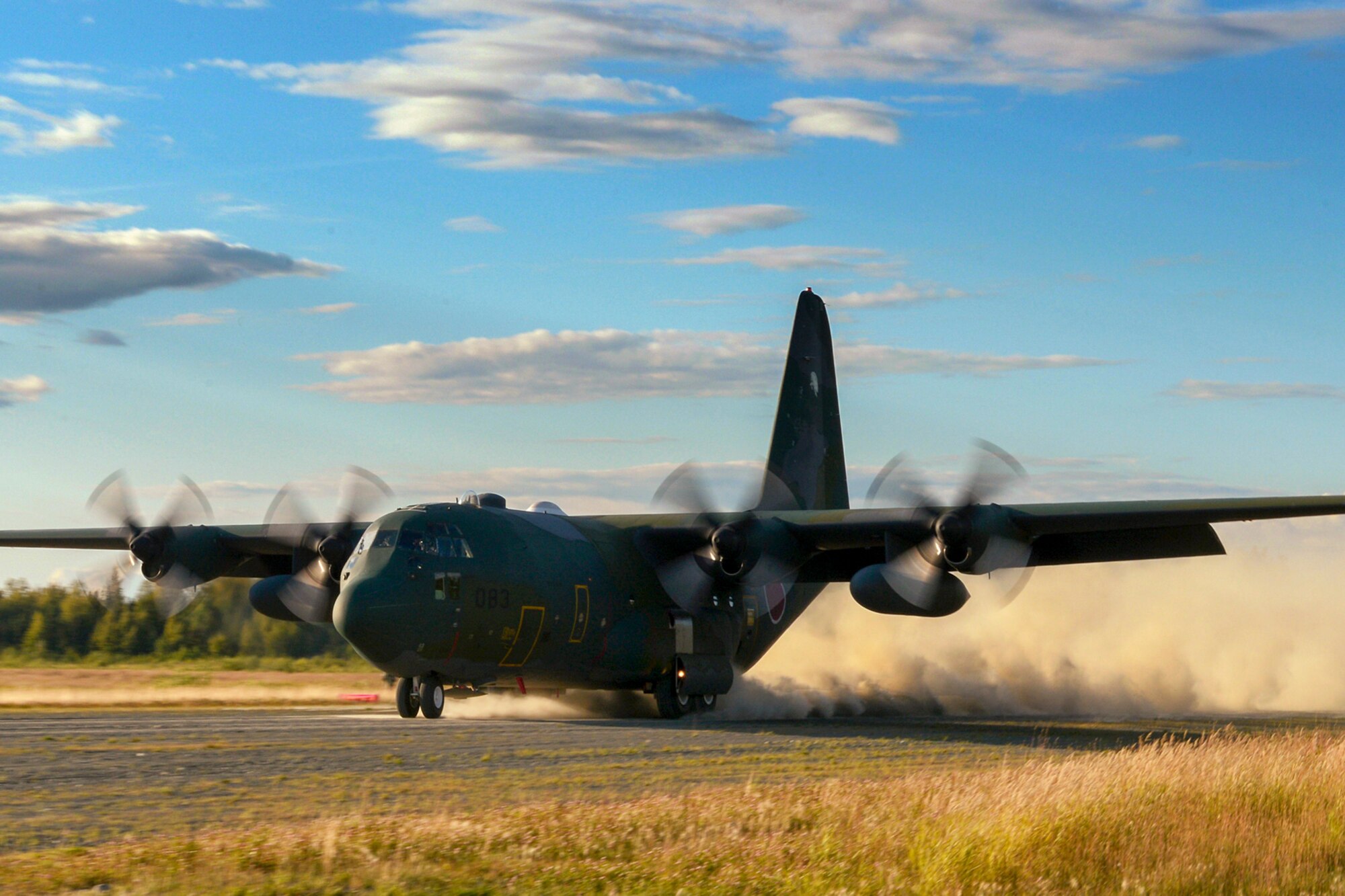 A C-130 Hercules with the Japanese Air Self-Defense Force lands on an austere runway used for training during RED FLAG-Alaska at Joint Base Elmendorf-Richardson, Alaska, Aug. 14, 2015. The training allowed C-130 aircrew to practice austere landings and take offs, combat offloads and supply drops, but also allowed friendly competition between participating Air Forces: U.S. Air Force, Japan Air Self-Defense Force, Royal Air Force, Royal Australian Air Force, Royal New Zealand Air Force and Royal Thai Air Force. Seasoned C-130 aircrew from each country judged the training exercises from the ground, allotting points based off predetermined timing and accuracy requirements. (U.S. Air Force photo by Staff Sgt. Cody H. Ramirez/Released)