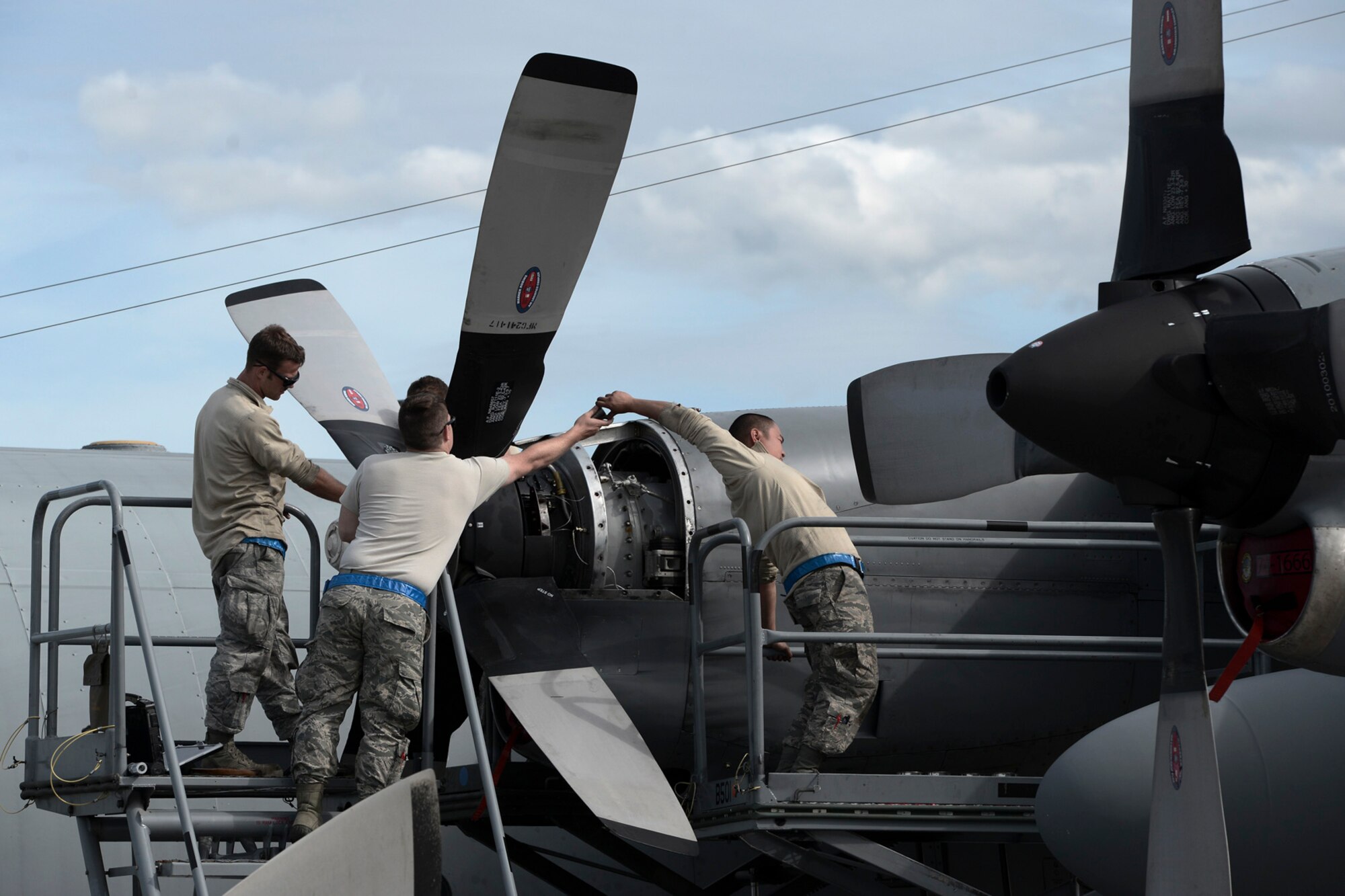 Members with the 374th Aircraft Maintenance Squadron replace a U.S. Air Force C-130 Hercules propeller during RED FLAG-Alaska at Joint Base Elmendorf-Richardson, Aug. 13, 2015. Maintainers attend a RED FLAG exercise every year with the 36th Airlift Squadron, ensuring aircrew have the assets required to train airlift capabilities. (U.S. Air Force by Staff Sgt. Cody H. Ramirez/Released)