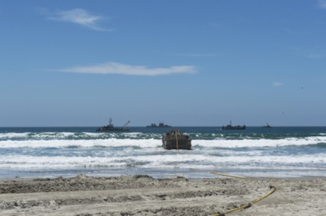 Marines with Bulk Fuel Co., 1st Marine Logistics Group, team up with Sailors from Amphibious Construction Battalion 1 to perform a beach unloading exercise using the Beach Termination Unit, in Coronado, Calif., Aug. 1-4, 2015. Approximately 30 Marines with Bulk Fuel Company, 7th Engineer Support Battalion, 1st Marine Logistics Group, teamed up with Sailors from Amphibious Construction Battalion 1 to conduct a beach unloading exercise. What made the training unique was the use of the BTU, which allows Marines to transfer fuel from a ship out in the ocean to Marines on land.