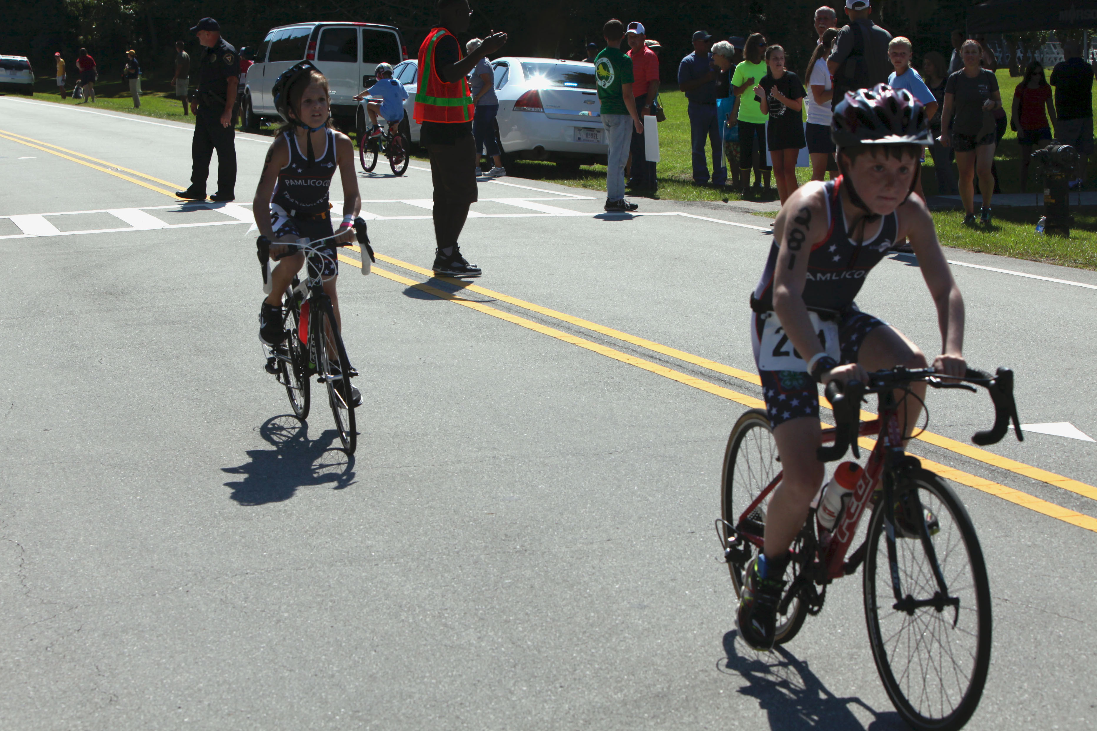Kids adults swim bike run in MCCS Triathlon