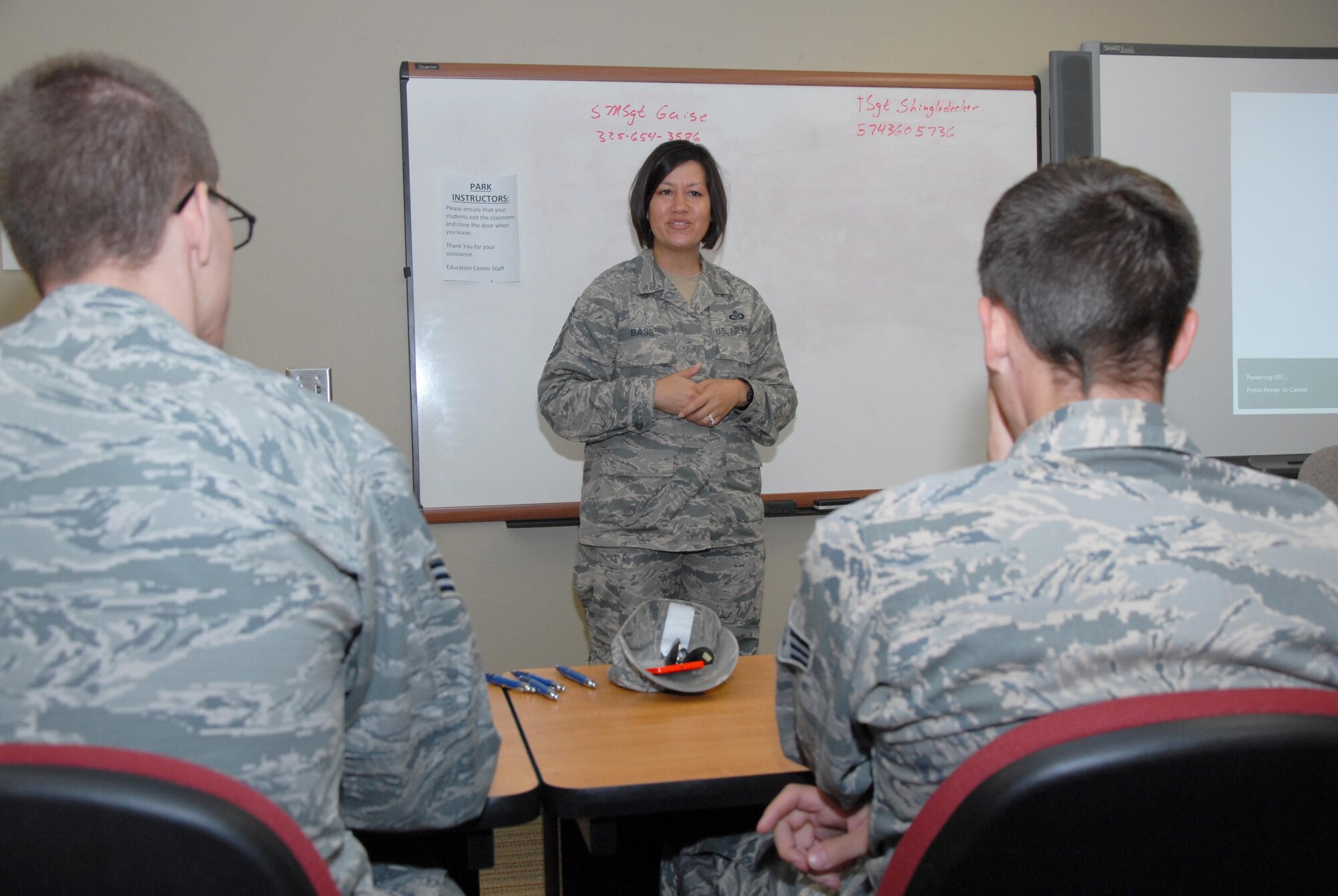 U.S. Air Force Chief Master Sgt. JoAnne S. Bass, 17th Training Wing Command Chief, speaks to Airmen during an Airmen Professional Development Course at the Consolidated Learning Center on Goodfellow Air Force Base, Texas, Aug. 10, 2015. The Airmen asked Bass about the Weighted Airman Promotion System, military to military marriages and more. (U.S. Air Force photo by Senior Airman Joshua Edwards/Released)