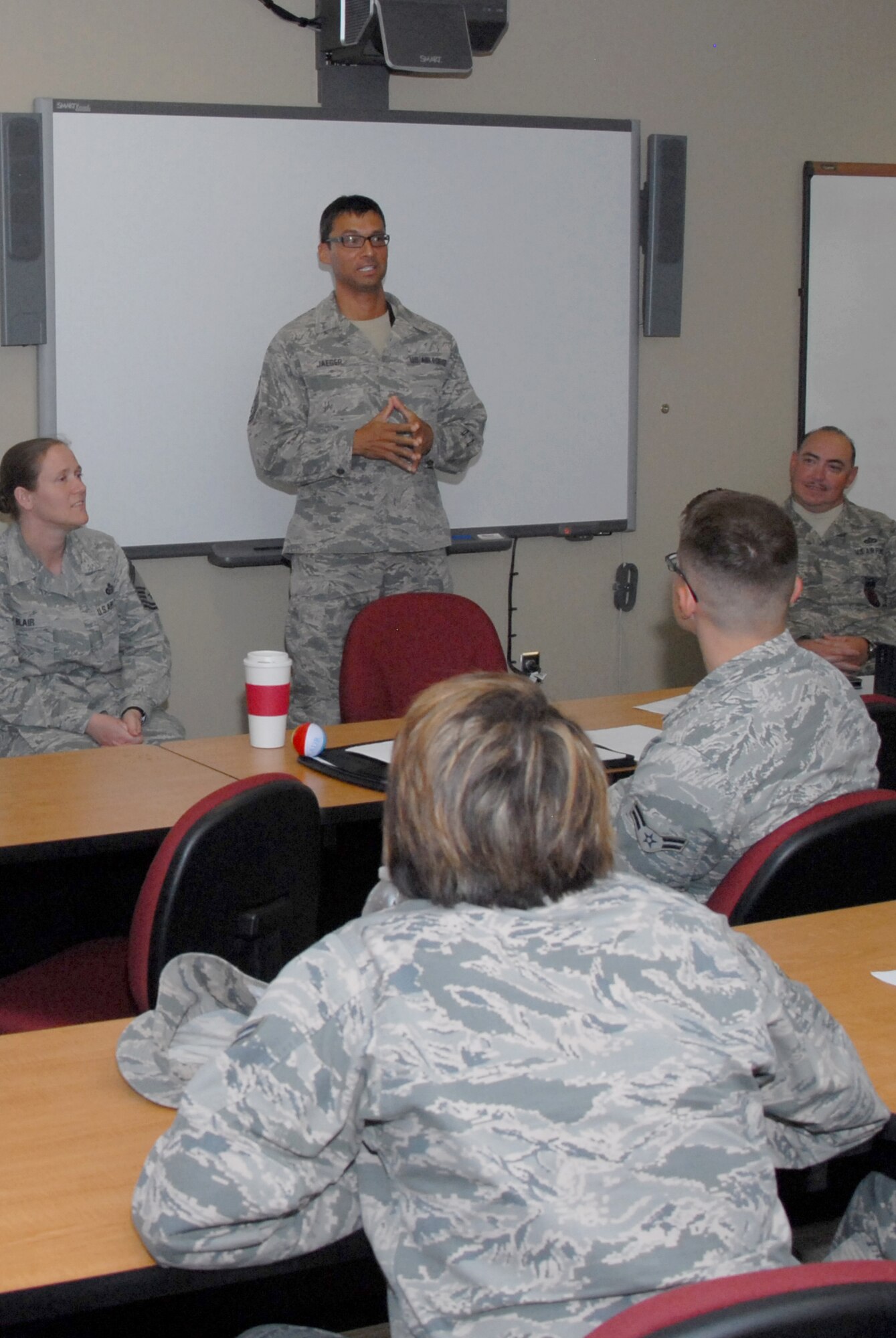 U.S. Air Force Chief Master Sgt. Israel Jaeger, 17th Communications Squadron chief enlisted manager, speaks to Airmen during an Airmen Professional Development Course at the Consolidated Learning Center on Goodfellow Air Force Base, Texas, Aug. 10, 2015. Jaeger and three other chiefs were the final session of a two-day course aimed at preparing junior-enlisted Airmen for future leadership positions. (U.S. Air Force photo by Senior Airman Joshua Edwards/Released)