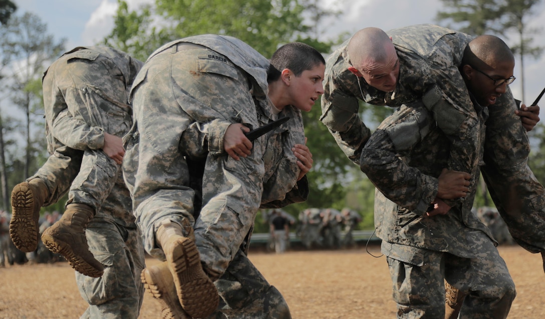 In this file photo, soldiers participate in combatives training during the Ranger Course on Fort Benning, Ga., April 20, 2015.  Soldiers attend Ranger school to learn additional leadership and technical and tactical skills in a physically and mentally demanding, combat simulated environment. U.S. Army photo by Spc. Nikayla Shodeen