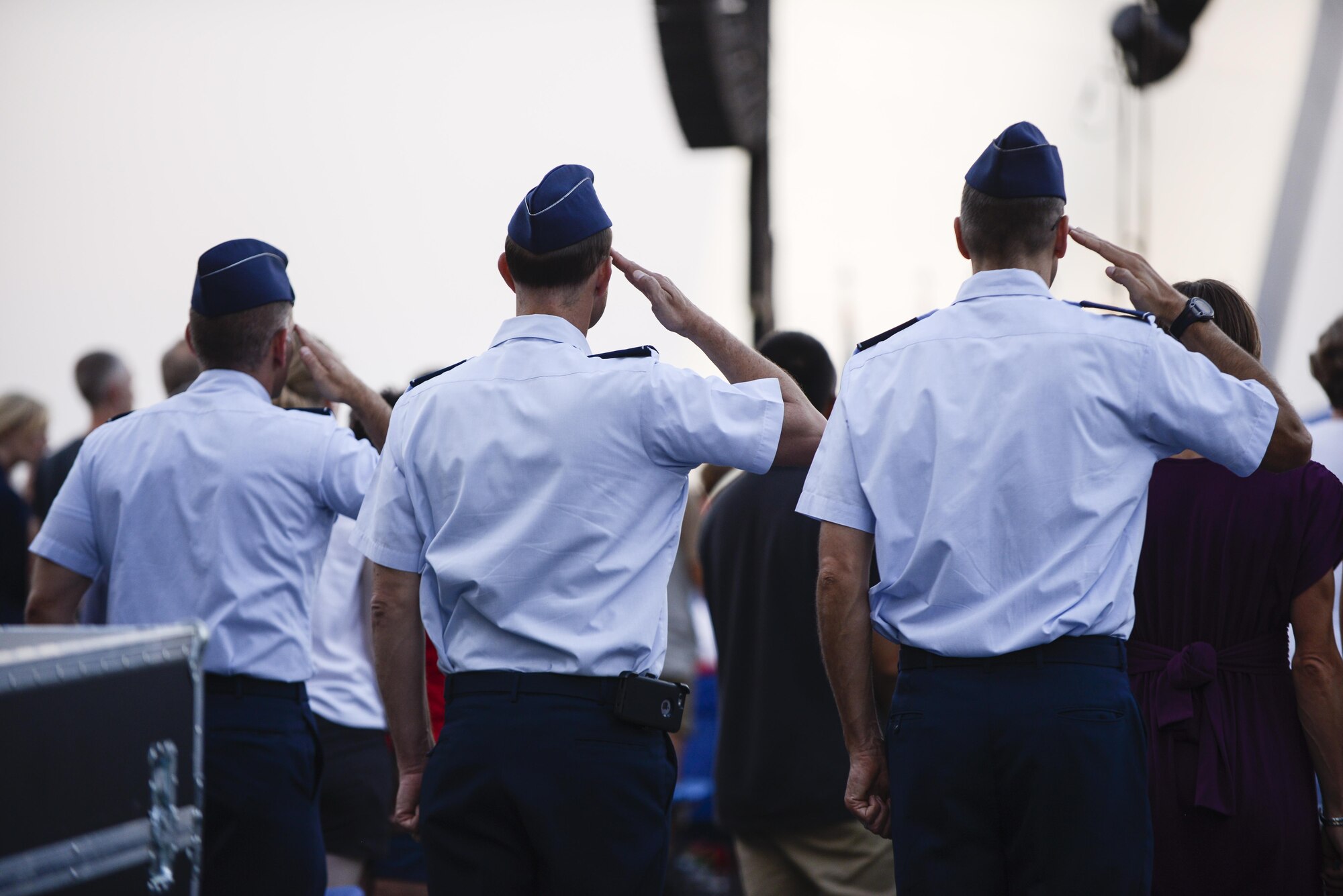 Airmen salute as the colors are presented during a wreath-laying ceremony commemorating the 70th anniversary of the end of World War II at the Air Force Memorial in Arlington, Va., Aug. 14, 2015.  (Air Force photo/Tech. Sgt. Joshua L. DeMotts)