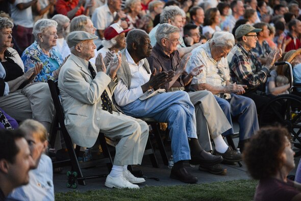 World War II veterans (from left) retired Brig. Gen. James 'J. Richard' Compton, retired Army Lt. CJ Moore, retired Army Sgt. Ron Locke, retired Marine Corps Sgt. Charley Schuck and retired Navy Capt. John Reed applaud a performance by the Air Force Band at the Air Force Memorial in Arlington, Va., Aug. 14, 2015.  The event included a wreath-laying ceremony and a four-ship P-51 Mustang flyover to commemorate the 70th anniversary of the end of World War II.  (Air Force photo/Tech. Sgt. Joshua L. DeMotts)