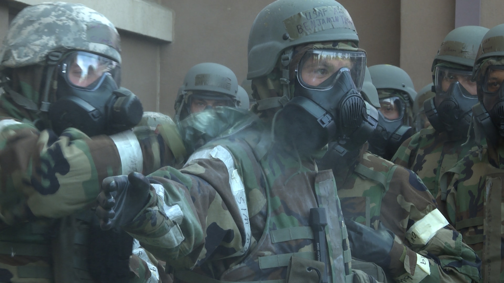 Senior Airman Ryan Clemmons, 51st Logistics Readiness Squadron fuels service center controller, uses an M-295 decontamination kit on Airman 1st Class Benjamin Thompson, 51st Civil Engineer Squadron emergency management apprentice, during a simulated chemical attack Aug. 18, 2015, at Osan Air Base, Republic of Korea. The M-295 decontamination kit is designed to help preserve individual suits by removing contamination on the overgarments, mask, gloves and boots. (U.S. Air Force photo by Staff Sgt. Benjamin Sutton)