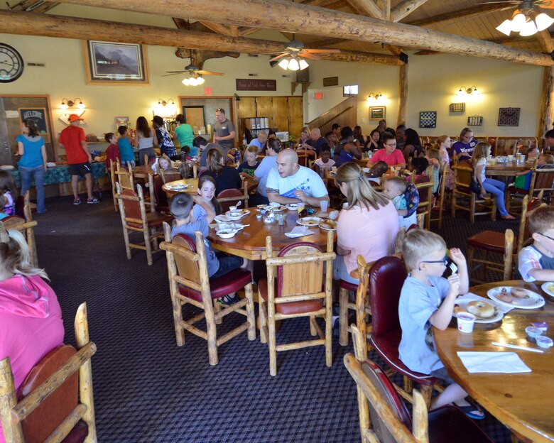 Participants from the 50th Space Wing Chapel-sponsored family retreat eat breakfast Sunday, Aug.16, 2015, at the Horn Creek Christian Camp and Conference Grounds in Westcliffe, Colorado. The retreat, which was held Aug. 14 – 16, gave 20 families from Schriever Air Force Base, Colorado the opportunity to disconnect from their electronic devices and reconnect with each other. (U.S. Air Force photo/Staff Sgt. Debbie Lockhart)