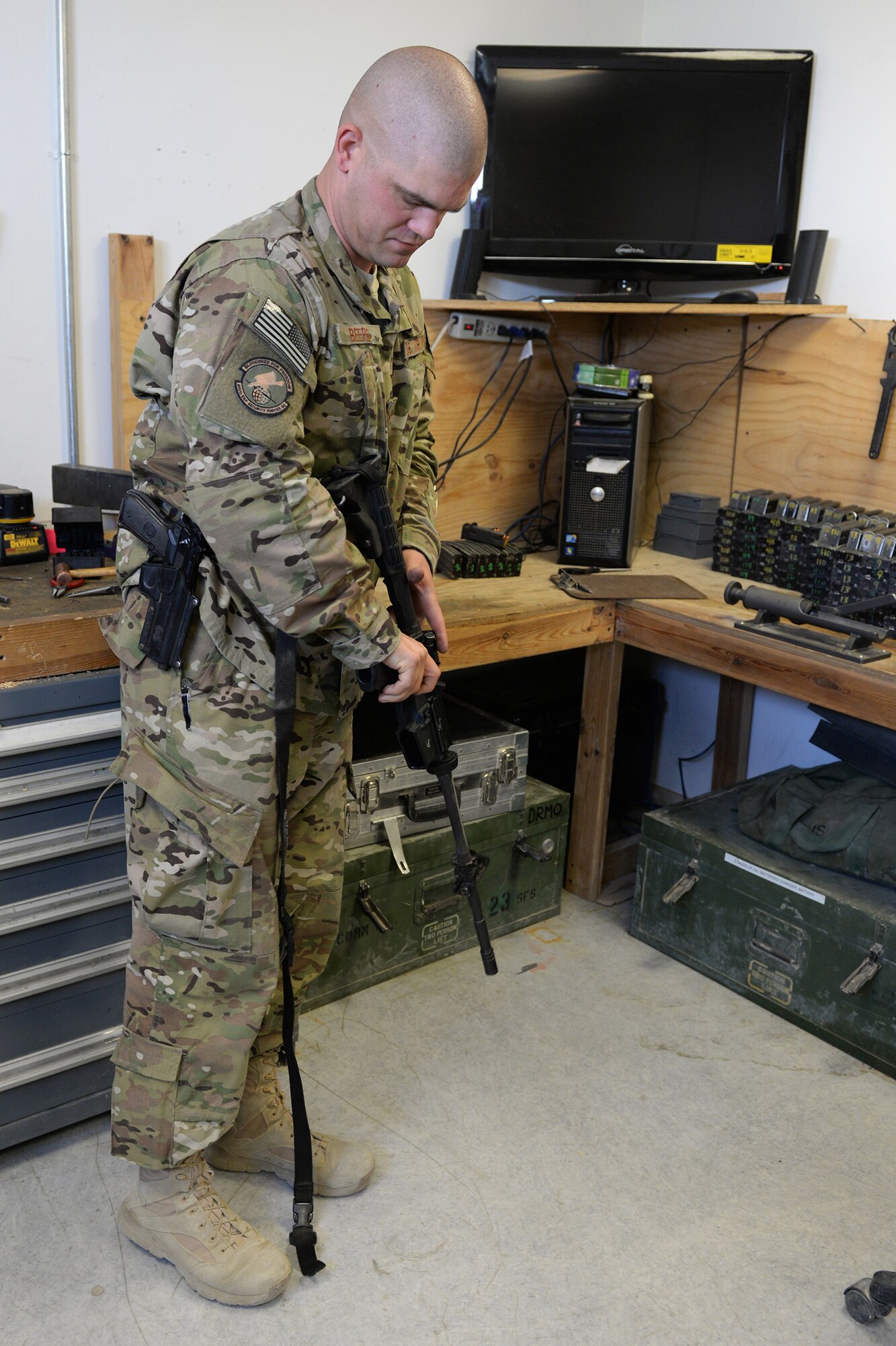 Tech. Sgt. Kevin Beers, 446th Security Forces Squadron combat arms instructor, out of Joint Base Lewis-McChord, Wash., searches for weapons parts for an M-4 rifle Aug. 10, 2015, at Bagram Air Field, Afghanistan. Beers is deployed as the CATM instructor for the 455th Expeditionary Security Forces Squadron. As Bagram’s only weapons repairman, he’s responsible for repairing weapons for the security forces squadron, logistics readiness squadron, Marines and all other units out of Bagram. (U.S. Air Force photo by Senior Airman Cierra Presentado)