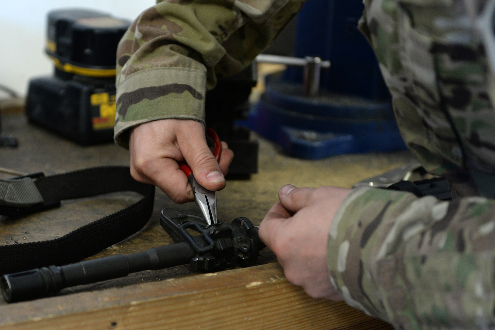 Tech. Sgt. Kevin Beers, 446th Security Forces Squadron combat arms instructor, out of Joint Base Lewis-McChord, Wash., searches for weapons parts for an M-4 rifle Aug. 10, 2015, at Bagram Air Field, Afghanistan. Beers is deployed as the CATM instructor for the 455th Expeditionary Security Forces Squadron. As Bagram’s only weapons repairman, he’s responsible for repairing weapons for the security forces squadron, logistics readiness squadron, Marines and all other units out of Bagram. (U.S. Air Force photo by Senior Airman Cierra Presentado)