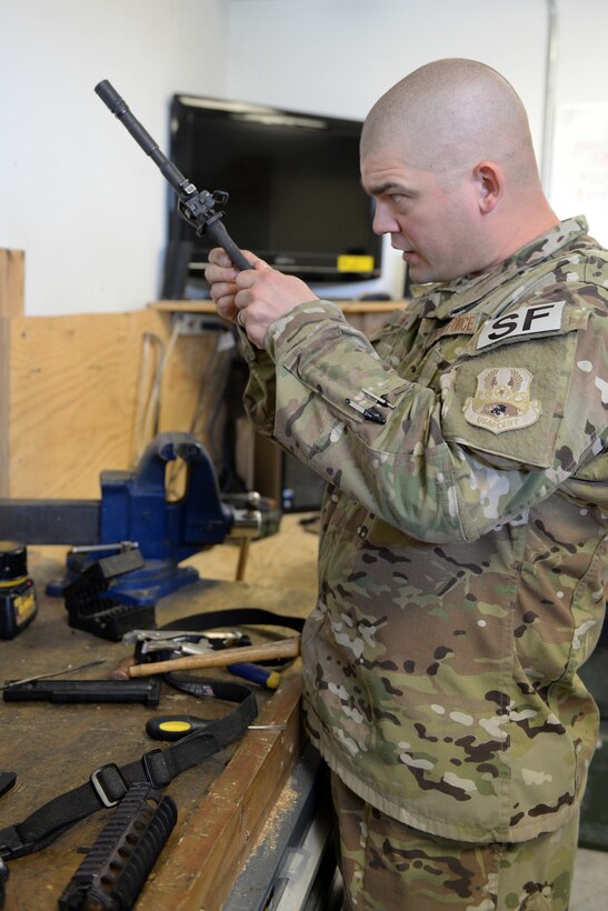 Tech. Sgt. Kevin Beers, 446th Security Forces Squadron combat arms instructor, out of Joint Base Lewis-McChord, Wash., searches for weapons parts for an M-4 rifle Aug. 10, 2015, at Bagram Air Field, Afghanistan. Beers is deployed as the CATM instructor for the 455th Expeditionary Security Forces Squadron. As Bagram’s only weapons repairman, he’s responsible for repairing weapons for the security forces squadron, logistics readiness squadron, Marines and all other units out of Bagram. (U.S. Air Force photo by Senior Airman Cierra Presentado)
