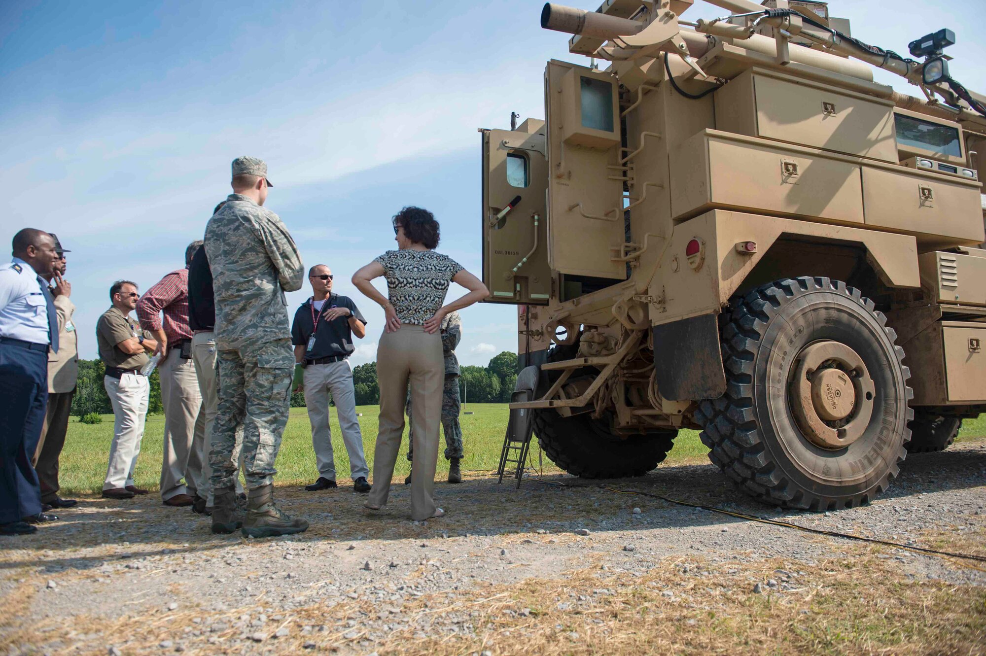 Stakeholders in the recovery of airbases denied by ordnance, or RADBO, vehicle project tour the vehicle before a live demonstration at Redstone Test Center, Alabama, July 16. RADBO has been in development for almost 10 years and is nearing the final stages of testing and development. (U.S. Air Force photo/Jess Echerri/Released)