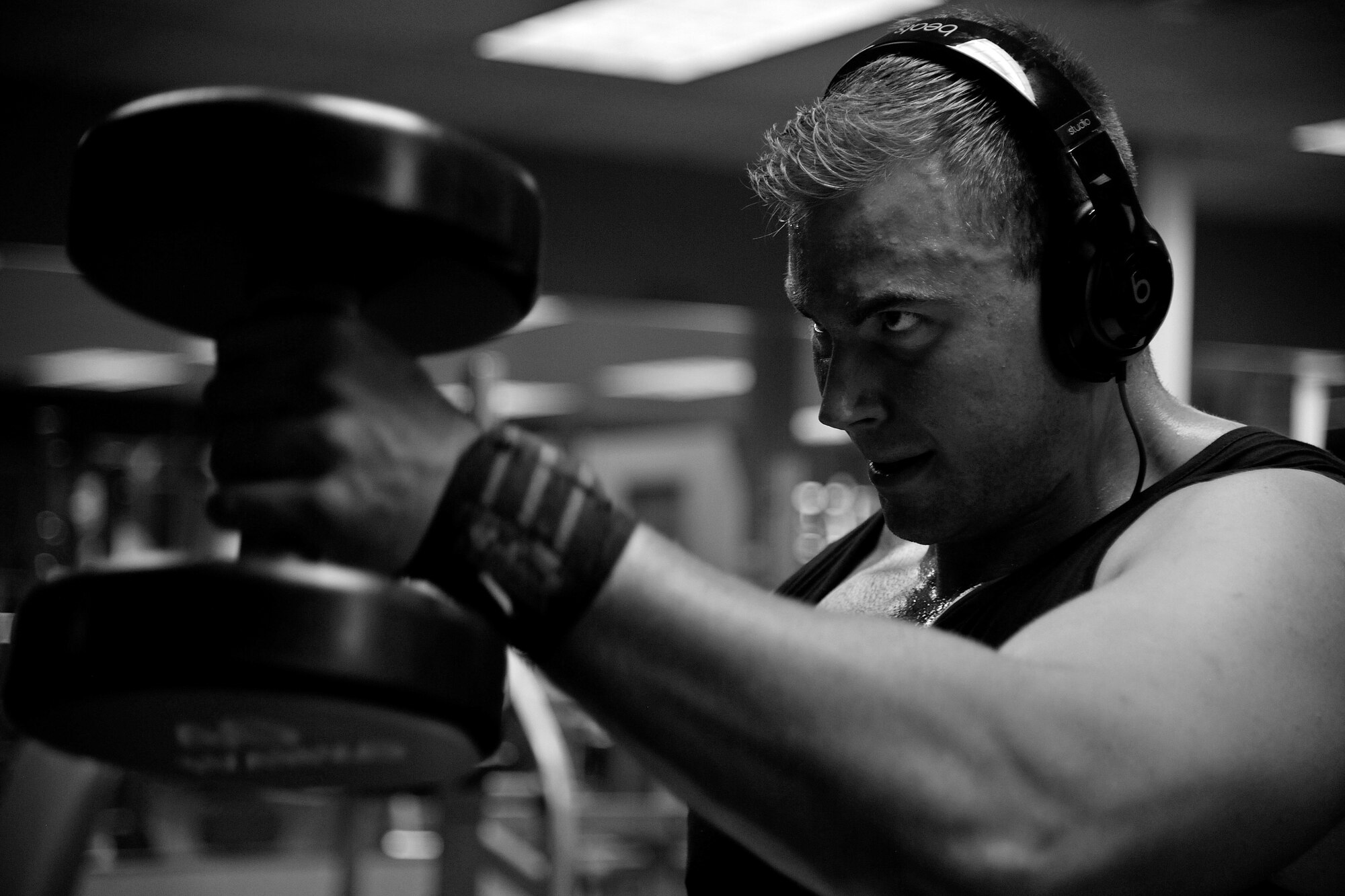 Free weights allow Airmen to help with their range of motion, teach proper form and increases motor neuron recruitment at the fitness center on Grand Forks Air Force Base, North Dakota, on Aug. 12, 2015. Being physically fit allows Airmen to properly support the Air Force mission. (U.S. Air Force photo by Senior Airman Xavier Navarro/released)