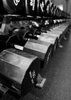 Free weights allow Airmen to help with their range of motion, teach proper form and increases motor neuron recruitment at the fitness center on Grand Forks Air Force Base, North Dakota, on Aug. 12, 2015. Being physically fit allows Airmen to properly support the Air Force mission. (U.S. Air Force photo by Senior Airman Xavier Navarro/released)