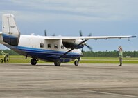 A maintainer marshals a taxiing C-145A into its parking spot at Duke Field,
Fla., Aug. 17 after it and its sister aircraft returned home together from a
lengthy overseas operational deployment.  The Air Force Special
Operations Command-owned aircraft was one of two Duke-based C-145s flying
their final non-standard aviation missions before their imminent retirement
to the Boneyard.  (U.S. Air Force photo/Dan Neely)
