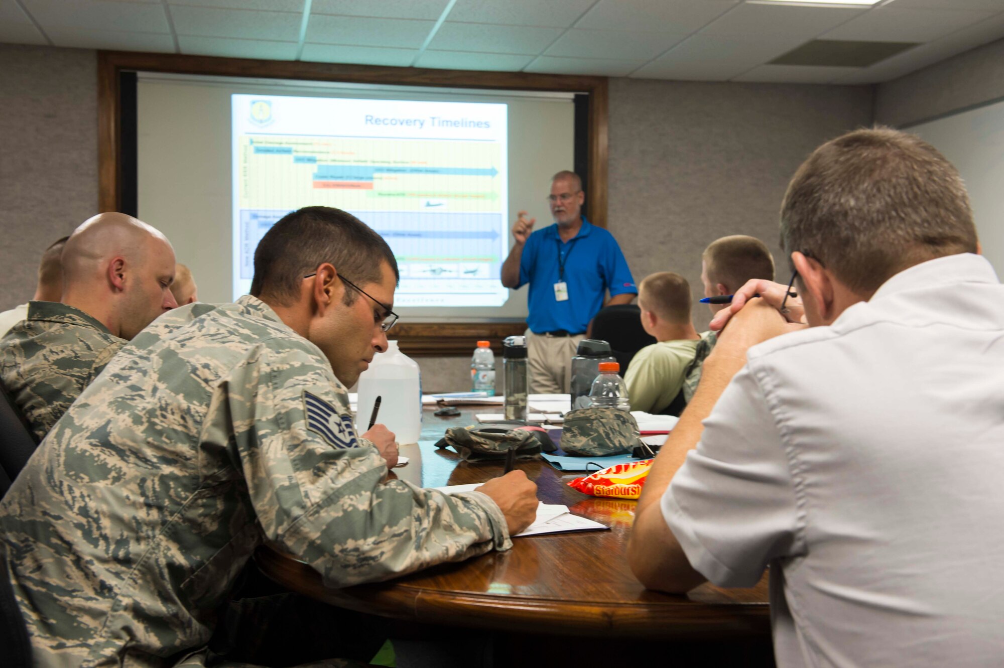 Tech. Sgt. Simon Zika, non-commissioned officer in charge of pavements and equipment contingency training at 554th Red Horse Squadron at Anderson Air Force Base, Guam, takes notes during the airfield damage repair mobile training team class held at the Air Force Civil Engineer Center at Tyndall Air Force Base, Florida, July 13. The class was the first of four classes offered by AFCEC that will instruct Airmen on how to train other Airmen on the new methods and standards for repairing runways. (U.S. Air Force Photo/Jess Echerri/Released)