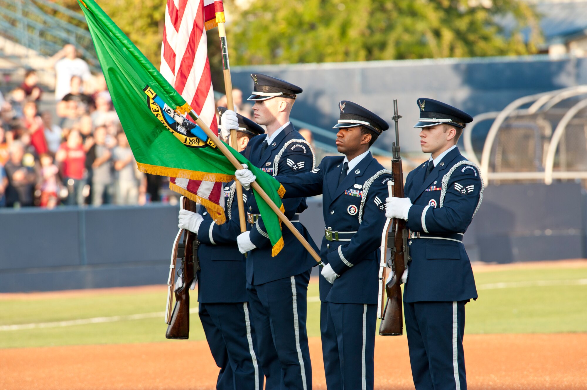 Fairchild Air Force Base Honor Guard present the colors Aug. 15, 2015, at Avista Stadium in Spokane, Wash. Fairchild members was asked to attend military appreciation night during the Spokane Indian’s baseball game to present the colors, unfurl a flag, and throw the first pitch. (U.S. Air Force photo/Airman Sean Campbell)