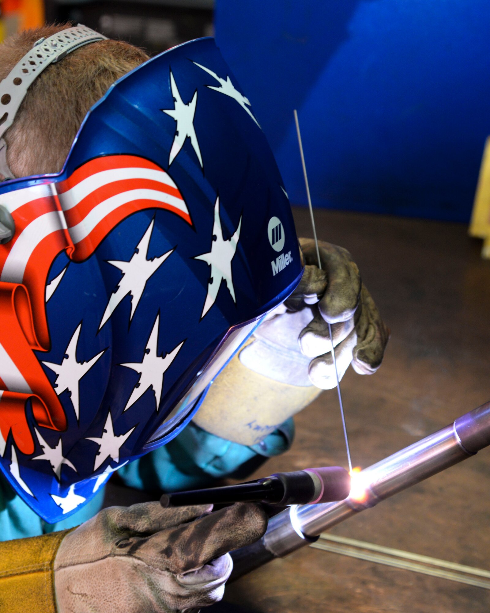 Senior Airman Brandon Bradley, 707th Maintenance Squadron metals technology journeyman, welds an aluminum tube mounted on a 45-degree fixture at Barksdale Air Force Base, La., Aug. 4, 2015. Airmen from the 707th and 2nd MXS work together as part of the Total Force Integration program. Metal techs use welding and machining skills to ensure the B-52 Stratofortress is mission ready.  (U.S. Air Force photo/Senior Airman Jannelle Dickey)