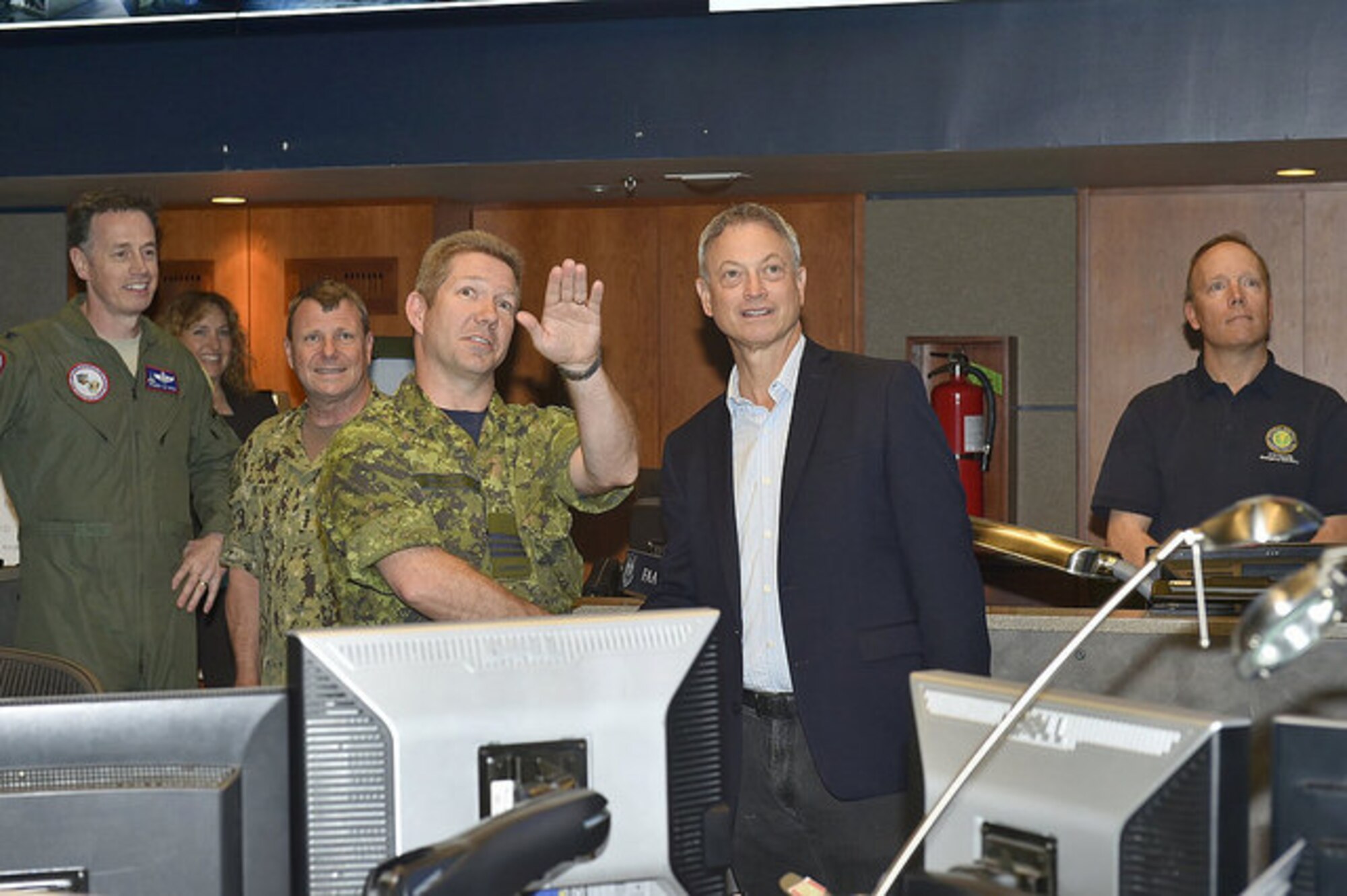 CHEYENNE MOUNTAIN AIR FORCE STATION, Colo. -Maj. Dragisa “Drag” Ivkovic, Cyber Domain Chief, explains to Mr. Gary Sinise, actor and founder of the Gary Sinise Foundation, the responsibilities of the Cyber Domain in monitoring cyber events within NORAD and USNORTHCOM’s Area of Responsibility in the North American Aerospace Defense Command and U.S. Northern Command Alternate Command Center located at Cheyenne Mountain Air Force Station.  The domain assesses the information and characterizes the impact of the cyber event to the commands’ senior leaders enabling them to make informed decisions.  An advocate of America’s servicemen and women, Sinise wanted to personally thank the troops assigned to CMAFS for the sacrifices that they, and their families, make every day to serve our great nation. (courtesy photo)