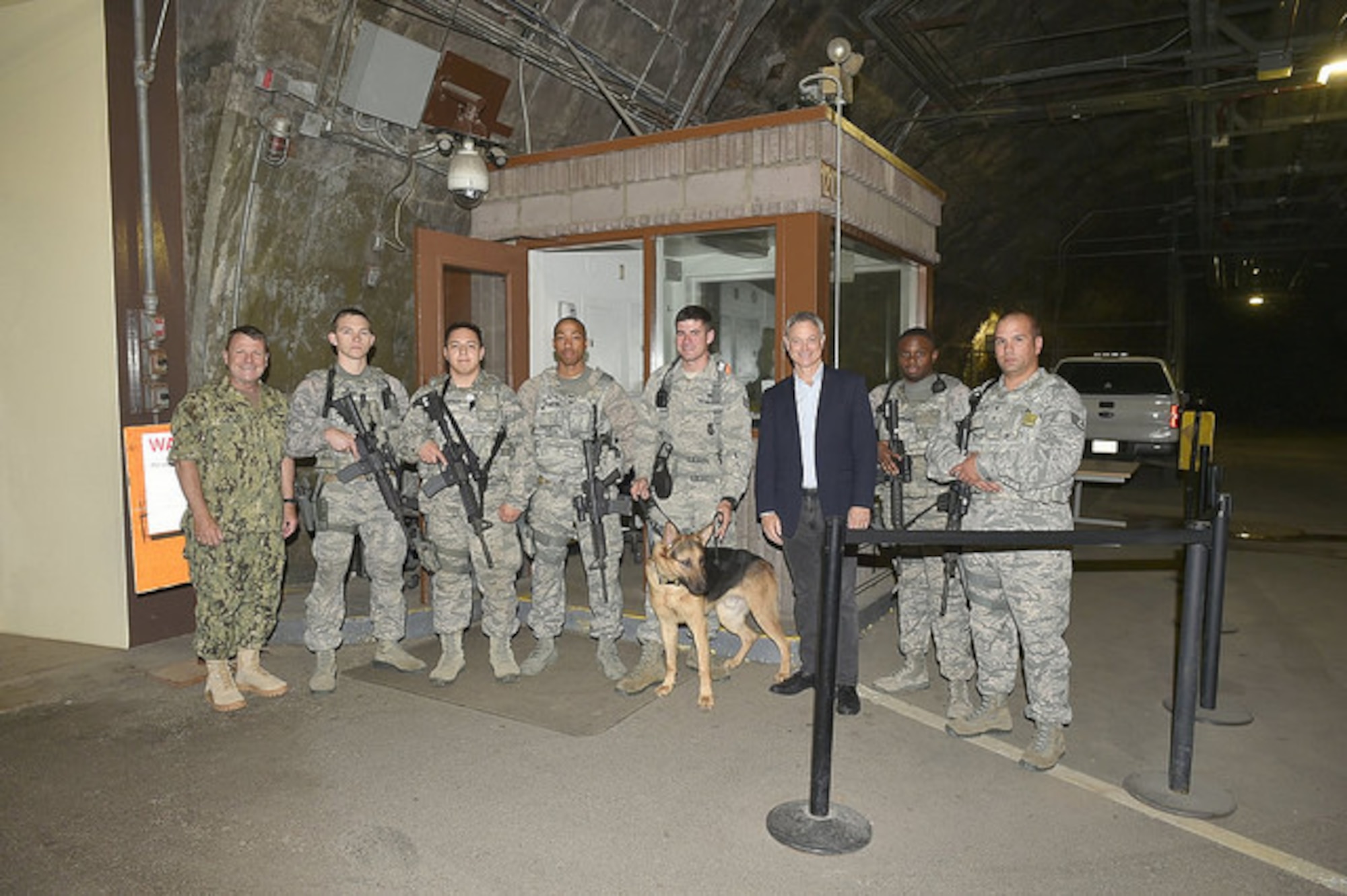 CHEYENNE MOUNTAIN AIR FORCE STATION, Colo. - After clearing security, U.S. Navy Adm. Bill Gortney,(left) commander, North American Aerospace Defense Command and U.S. Northern Command, and Gary Sinise, actor and founder of the Gary Sinise Foundation, pose for a group photo with members of the 721st Security Forces Squadron at Cheyenne Mountain Air Force Station on Aug. 9, 2015.  An advocate of America’s servicemen and women, Sinise wanted to personally thank the troops assigned to CMAFS for the sacrifices that they, and their families, make every day to serve our great nation.  The 721st SFS is responsible for protecting the overall security of the people and priority resources at Cheyenne Mountain Air Force Station. (courtesy photo)