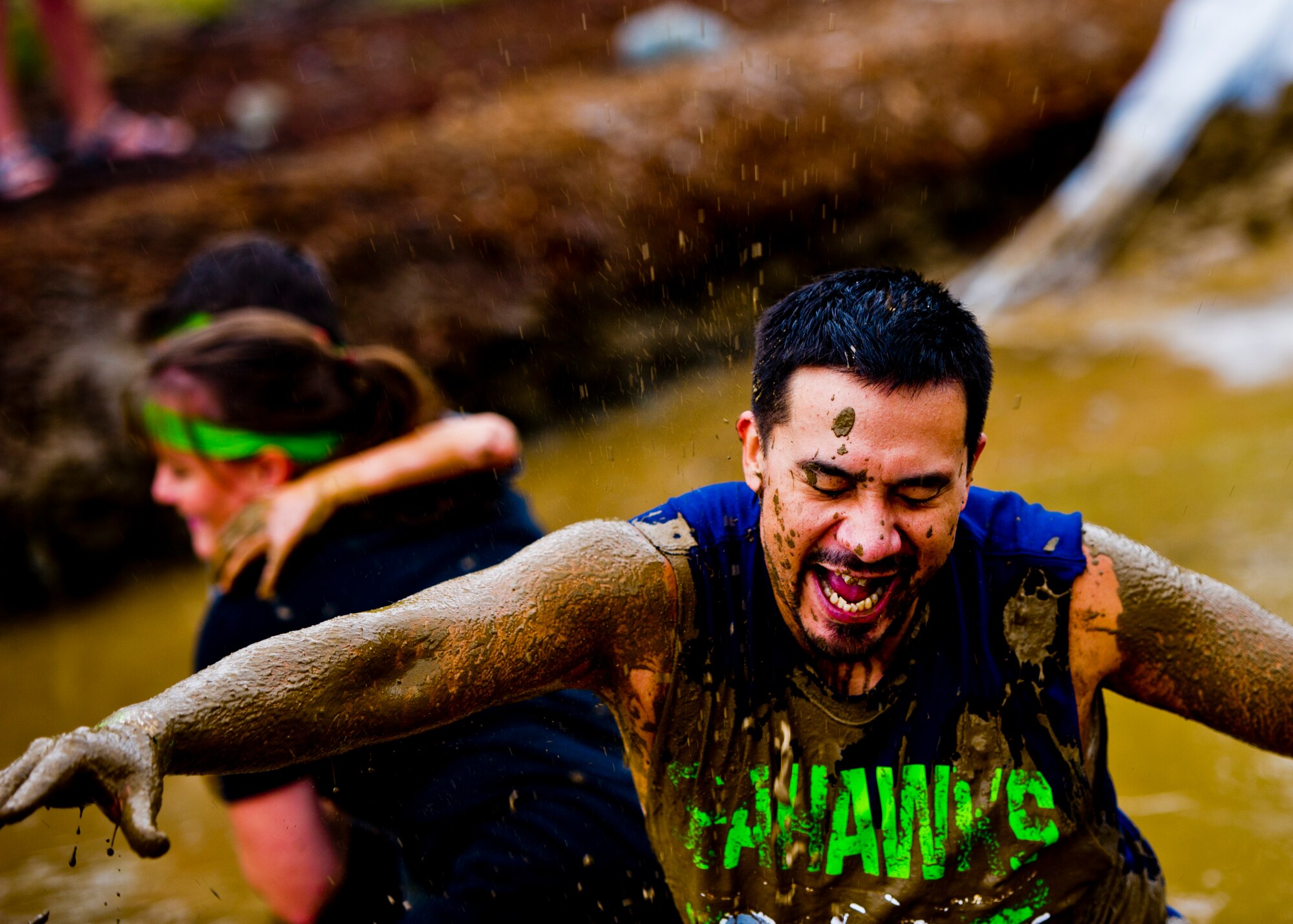 A participants in the Beast Mode Challenge sponsored by the Air Force Reserve, races through an obstacle course in Snoqualmie, Wash., Aug. 15, 2015. The challenge was composed of a 3.5-mile mud-ridden obstacle course - with 12 football-themed trials of hills, blockades, water, and sludge, created to trigger one's inner Beast Mode. A portion of the race proceeds and 100% of donations went directly to the  Fam 1st Family Foundation co-founded by Marshawn ‘Beast Mode’ Lynch of the Seattle Seahawks. The Fam 1st Family Foundation is dedicated to uplifting and empowering youth in the Bay Area and throughout the United States. The foundation’s mission is one of empowerment and education,aiming to build self-esteem and academic learning skills in underprivileged youth. (U.S. Air Force Reserve photo by Senior Airman Daniel Liddicoet/Released)
