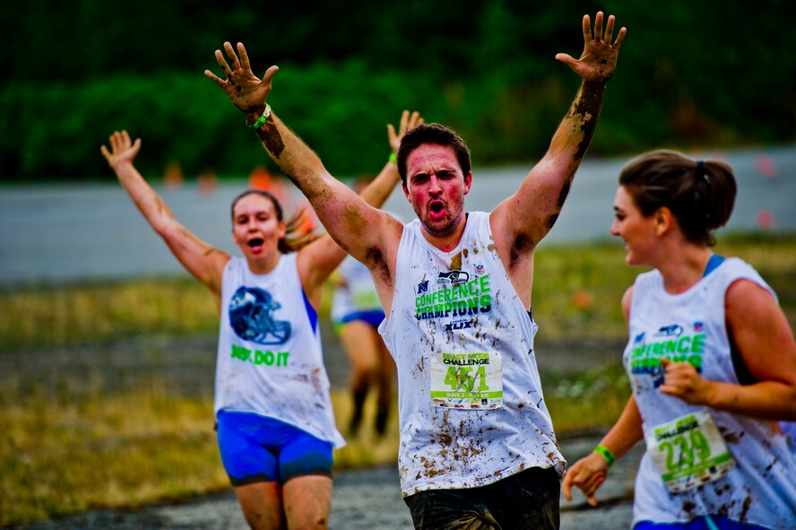 Participants in the Beast Mode Challenge sponsored by the Air Force Reserve, race through an obstacle course in Snoqualmie, Wash., Aug. 15, 2015. The challenge was composed of a 3.5-mile mud-ridden obstacle course - with 12 football-themed trials of hills, blockades, water, and sludge, created to trigger one's inner Beast Mode. A portion of the race proceeds and 100% of donations went directly to the  Fam 1st Family Foundation co-founded by Marshawn ‘Beast Mode’ Lynch of the Seattle Seahawks. The Fam 1st Family Foundation is dedicated to uplifting and empowering youth in the Bay Area and throughout the United States. The foundation’s mission is one of empowerment and education,aiming to build self-esteem and academic learning skills in underprivileged youth. (U.S. Air Force Reserve photo by Senior Airman Daniel Liddicoet/Released)
