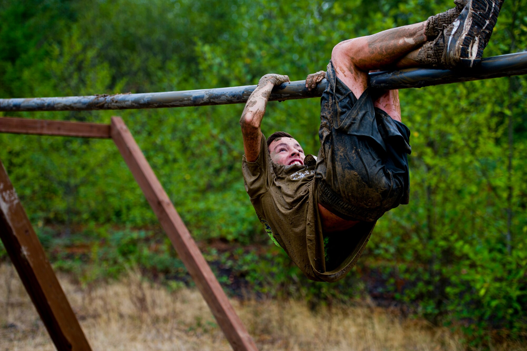 A participant in the Beast Mode Challenge sponsored by the Air Force Reserve, race through an obstacle course in Snoqualmie, Wash., Aug. 15, 2015. The challenge was composed of a 3.5-mile mud-ridden obstacle course - with 12 football-themed trials of hills, blockades, water, and sludge, created to trigger one's inner Beast Mode. A portion of the race proceeds and 100% of donations went directly to the  Fam 1st Family Foundation co-founded by Marshawn ‘Beast Mode’ Lynch of the Seattle Seahawks. The Fam 1st Family Foundation is dedicated to uplifting and empowering youth in the Bay Area and throughout the United States. The foundation’s mission is one of empowerment and education,aiming to build self-esteem and academic learning skills in underprivileged youth. (U.S. Air Force Reserve photo by Senior Airman Daniel Liddicoet/Released)
