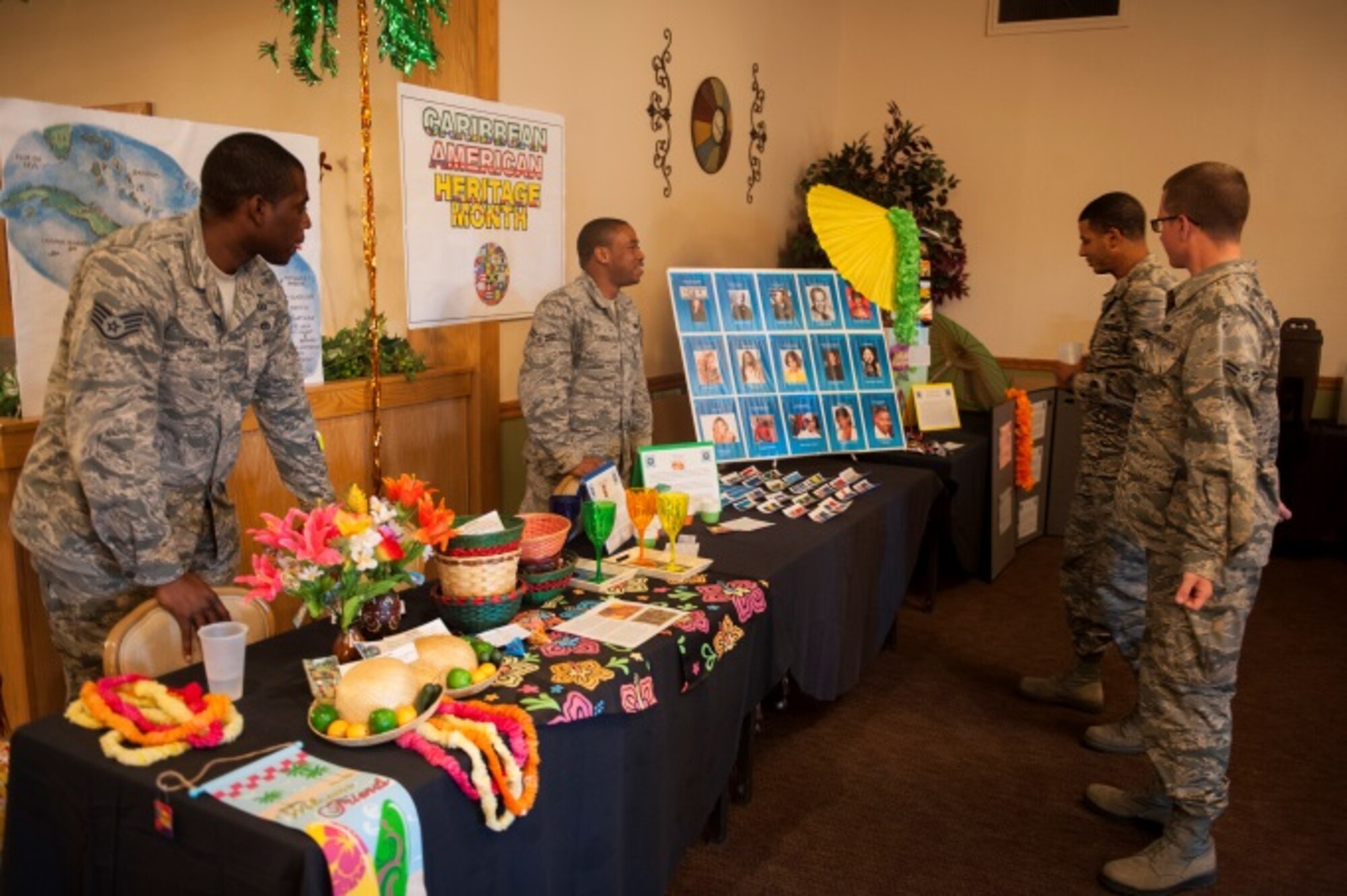 Minot Airmen receive information at the Caribbean American culture booth during Diversity Day at Minot Air Force Base, N.D., Aug. 14, 2015. Diversity Day showcased many different cultures including Irish, European, Asian-Pacific American, African American and many more. (U.S. Air Force photo/Airman 1st Class Christian Sullivan)