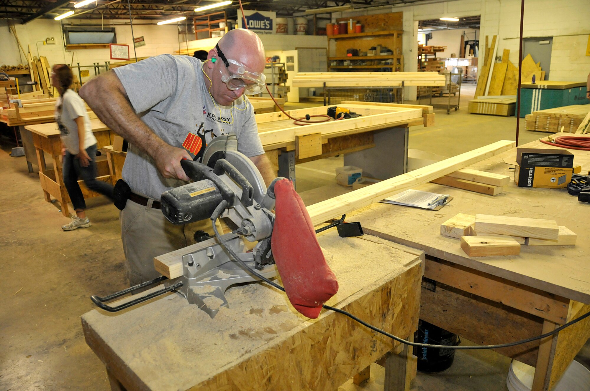 KNOXVILLE, Tenn. - Master Sgt. Don Pierson, a manager assigned to the I.G. Brown Training and Education Center on McGhee Tyson Air National Guard Base, cuts lumber inside a wood shop August 18, 2015, to fabricate window and door frames. About a dozen military volunteers took part in the two-day Habitat for Humanity project in North Knoxville. (U.S. Air National Guard photo by Master Mike R. Smith/Released)
