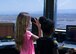 Children from the Holloman Youth Center test binoculars at the Holloman Air Traffic Control tower during a base tour on Aug. 12. The youth center received an inside look at the tower and how important it is for Holloman’s every day flying missions. During the tour, the children traveled to the 11th floor to look out over the base, they also visited the simulators for new Airmen coming into the ATC career field. The tour was also part of the Tuskegee Airmen Initiative that supports children’s interest and knowledge in fields of aviation. (U.S. Air Force photo by Senior Airman Leah Ferrante)