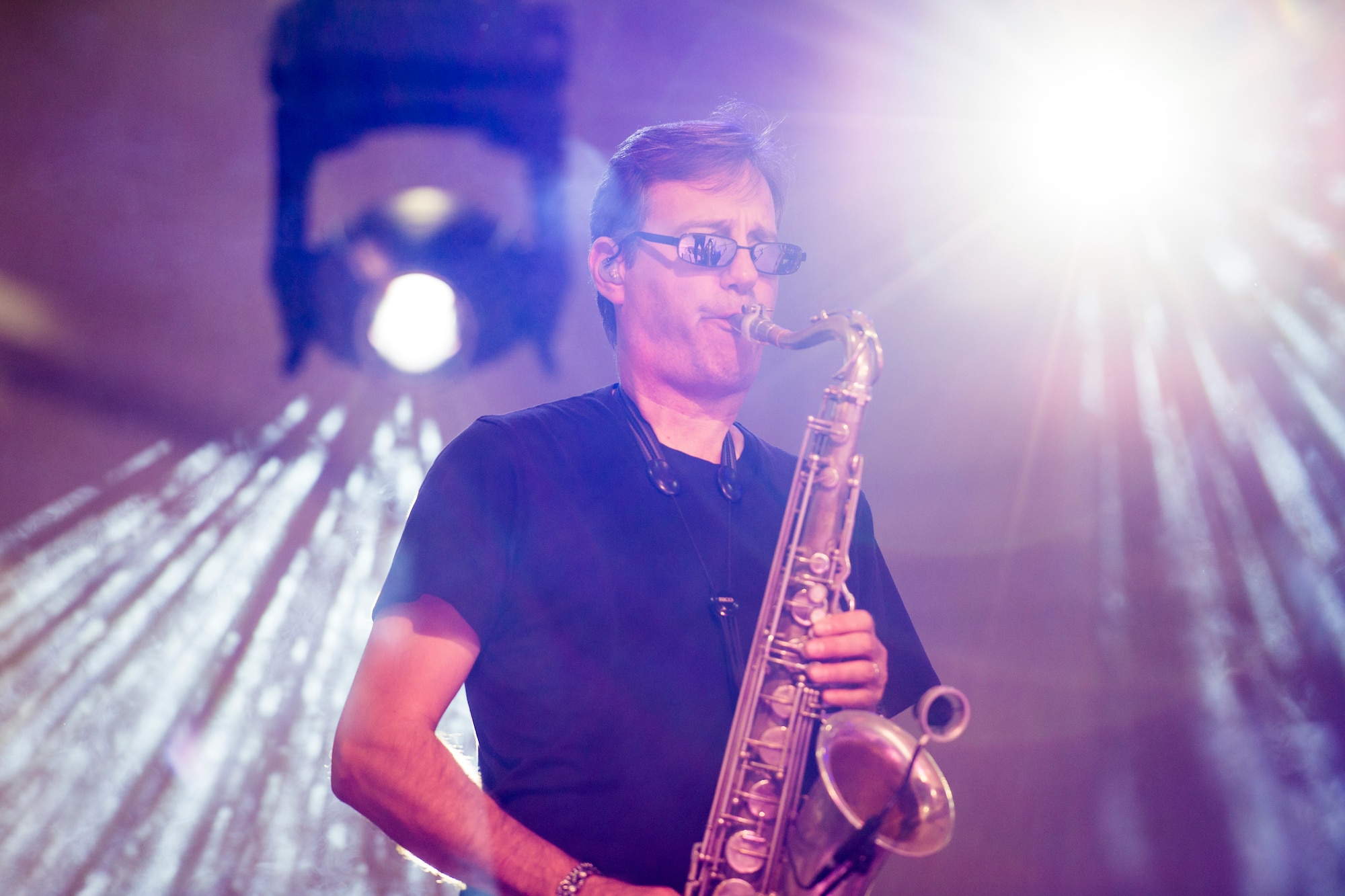 Mitch Paliga, Lt. Dan Band saxophonist, performs with the band in Dock 1 at Minot Air Force Base, N.D., Aug. 15, 2015. The Lt. Dan Band, a program of the Gary Sinise Foundation, is a 12-member group that has performed hundreds of concerts for military members worldwide since 2003. (U.S. Air Force photo/ Airman 1st Class Justin T. Armstrong)