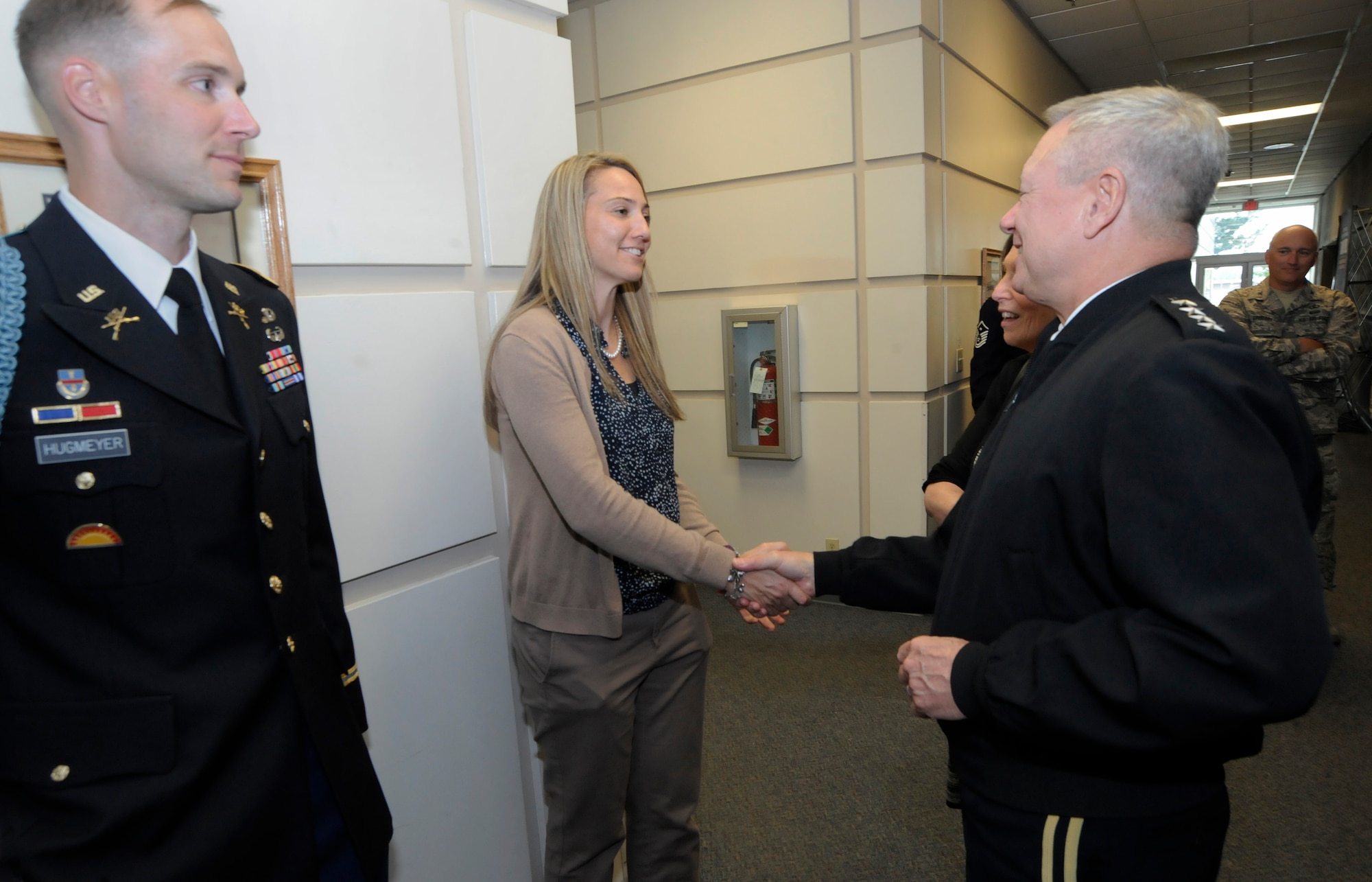 Army Gen. Frank J. Grass, Director of the National Guard Bureau, greets Ms. Amy Conroy, 142nd Fighter Wing Family Programs Director, following a town hall event, Portland Air National Guard Base, Ore., Aug. 15, 2015. (U.S. Air National Guard photo by Tech. Sgt. John Hughel, 142nd Fighter Wing Public Affairs/Released)