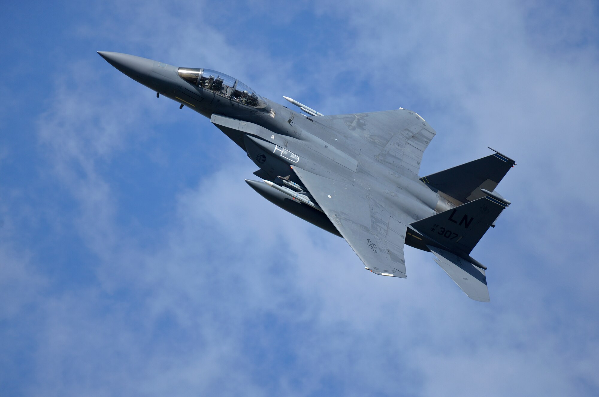 An F-15E Strike Eagle, assigned to the 48th Fighter Wing, flies over Royal Air Force Lakenheath, England, during a training sortie, Aug. 17, 2015. The 48th FW is responsible for providing air combat superiority for United States Air Forces in Europe and Air Forces Africa area of responsibility. (U.S. Air Force photo by Senior Airman Trevor T. McBride/Released)
